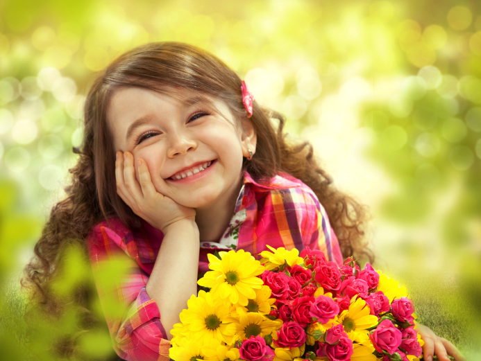Smiling girl with big bouquet of flowers