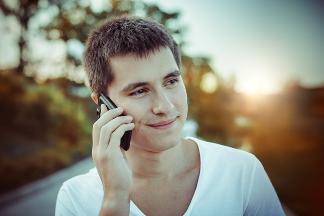 Man talking by the mobile phone outdoors