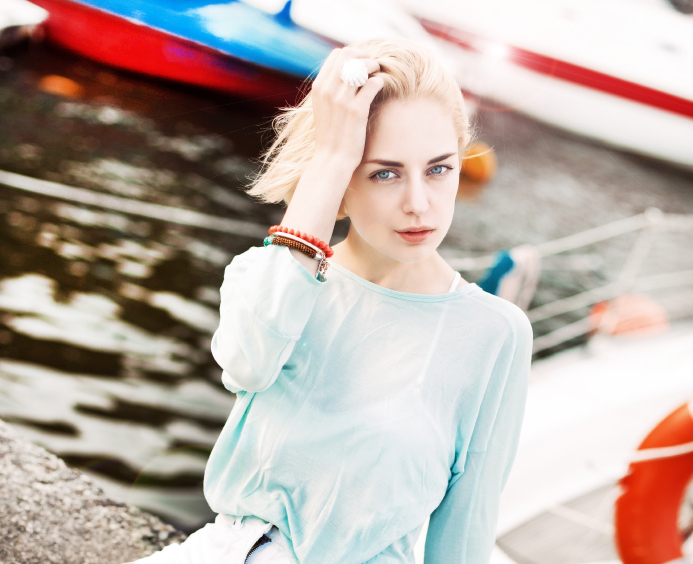 beautiful girl at sea pier