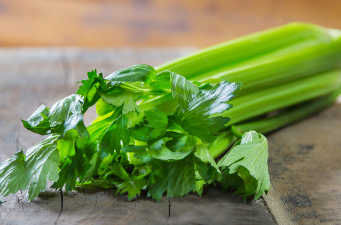 Celery on wooden table