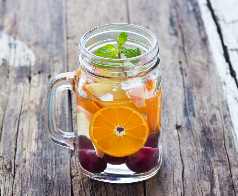 Mug delicious refreshing drink of mix fruits with mint, infusion