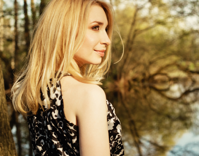 Profile portrait of beautiful blonde outdoors