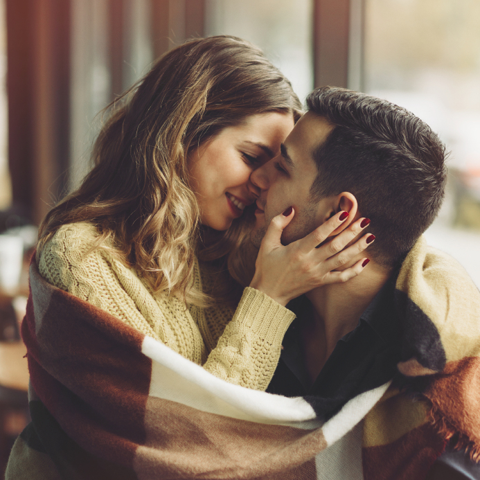 Couple in love drinking coffee in coffee shop